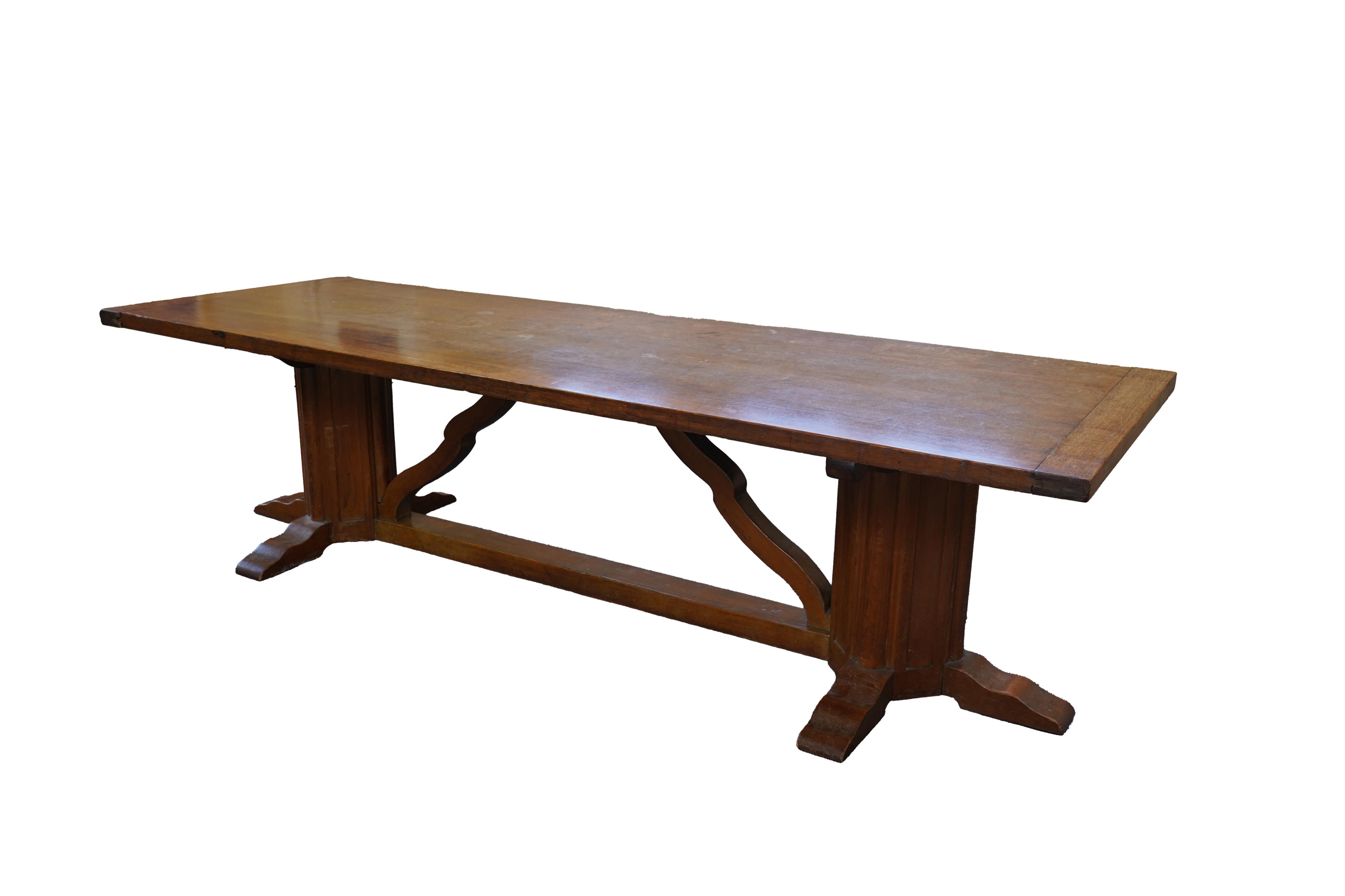 An Arts and Crafts oak refectory dining table